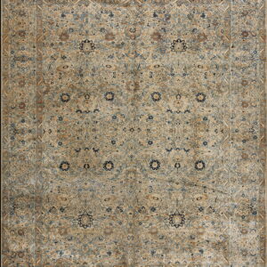 Traditional ornate rug featuring all-over floral motifs in faded tan, light blue, dark blue, and brown.