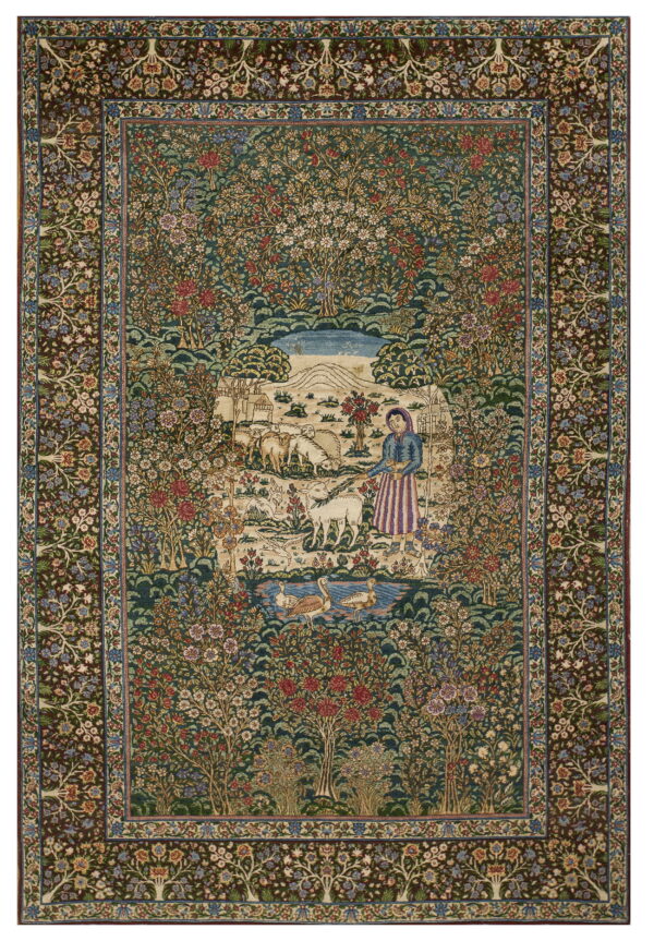 Dark green rug featuring a central pastoral scene, surrounded by dense multicolored flowering trees and a brown border.