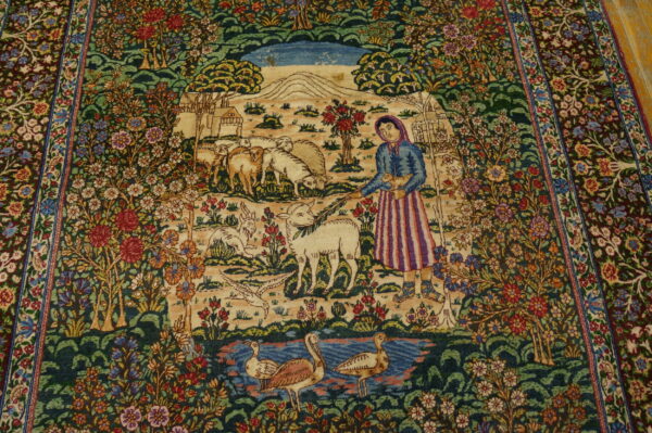 Low-pile rug depicting a shepherdess, grazing animals, and ducks surrounded by detailed floral borders.