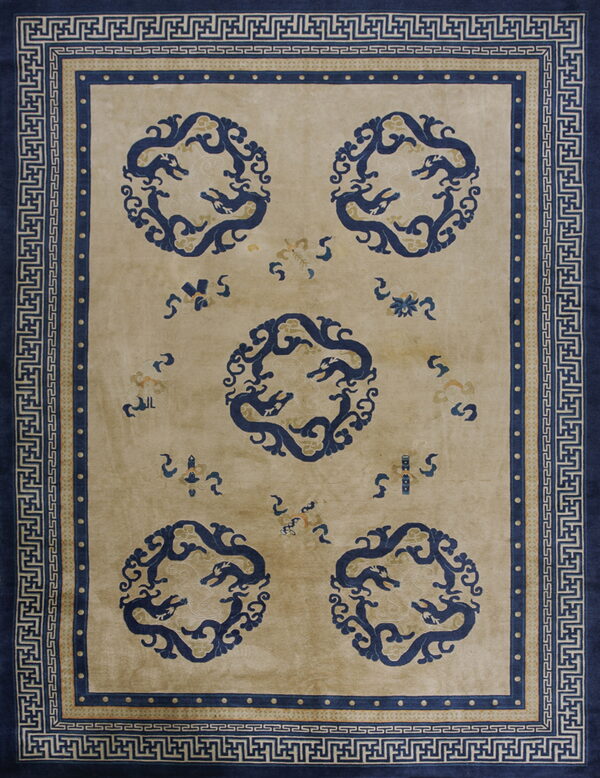 A beige high-pile rug with five blue dragon medallions and wide geometric borders.