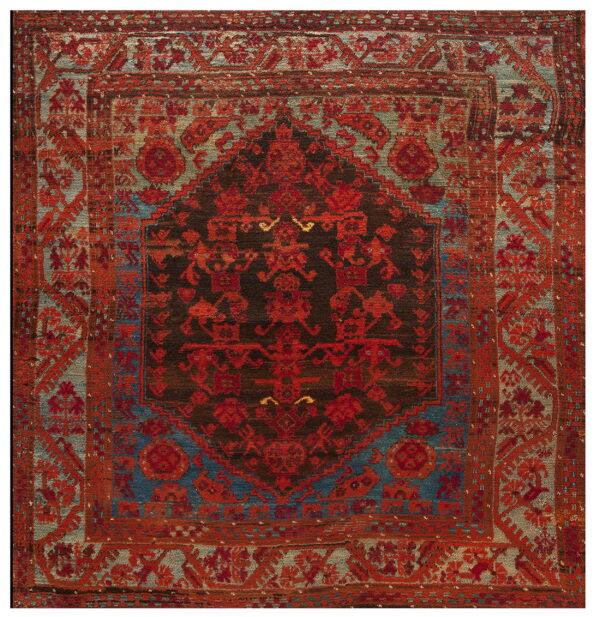Intricately patterned square rug featuring deep red and dark brown motifs against fields of muted blue and gray.