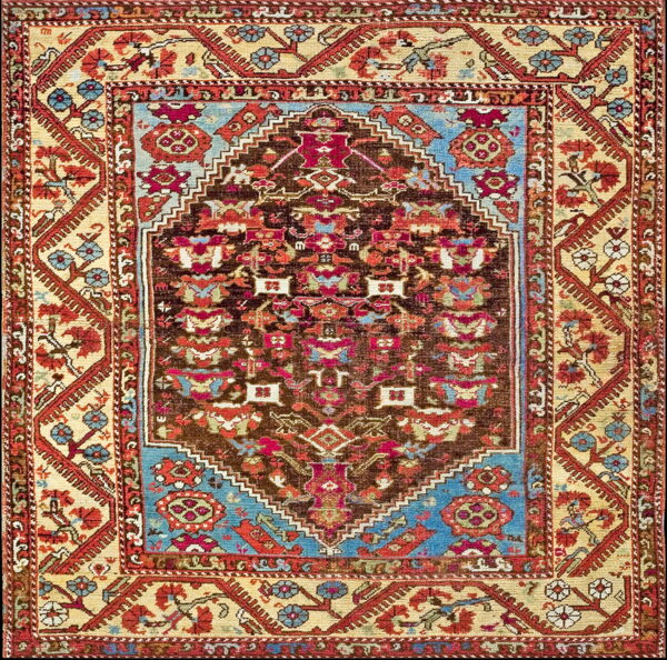Detailed low-pile rug featuring a dark brown geometric central field framed by contrasting cream, red, and bright blue borders.