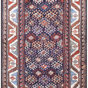 Geometric runner with a dark blue center field and a busy border of red, white, and blue stepped triangles.