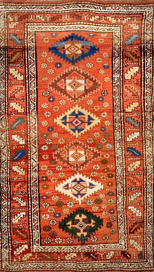 Colorful geometric patterned antique rug