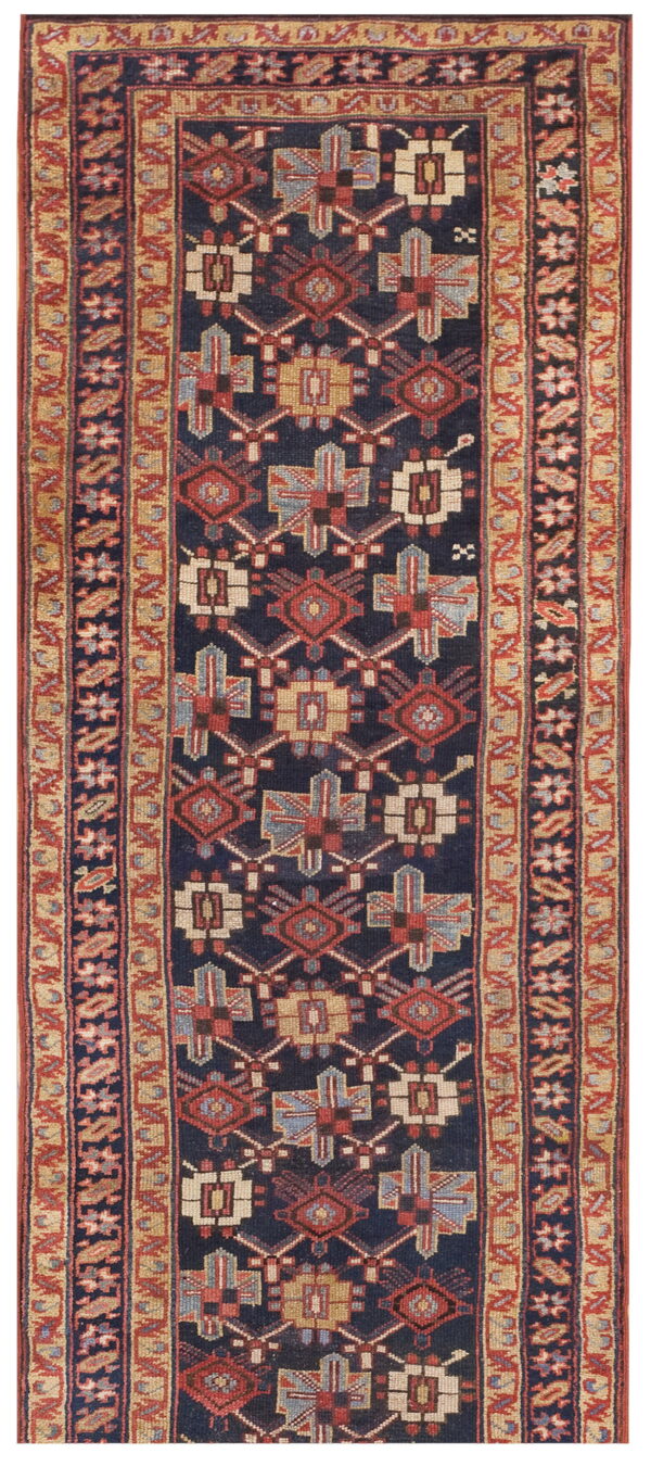 Narrow rug with a navy field, red, tan, and light blue geometric patterns, and multiple banded borders.