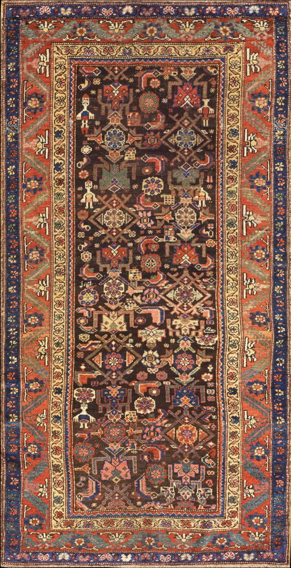 Dark brown runner rug with densely packed multicolored geometric figures bordered by broad rust red bands.
