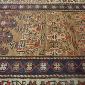 Intricate patterned antique Kurdish rug.