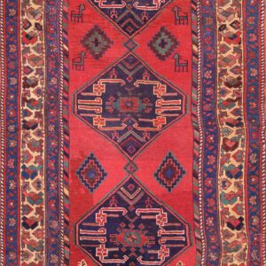 Vibrant red rug with intricate patterns.