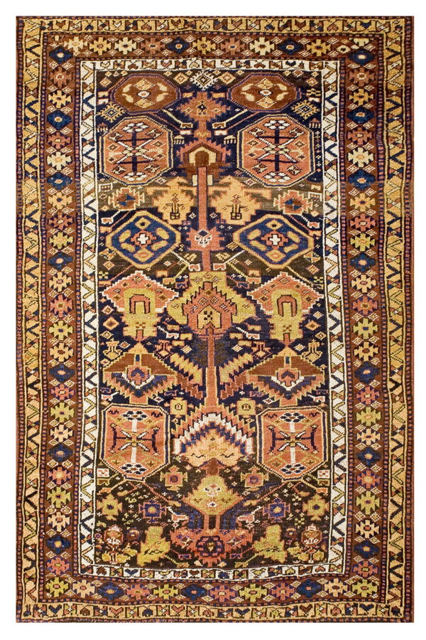 Close-up of a runner rug with a tribal geometric pattern in indigo, rust, mustard, and brown.