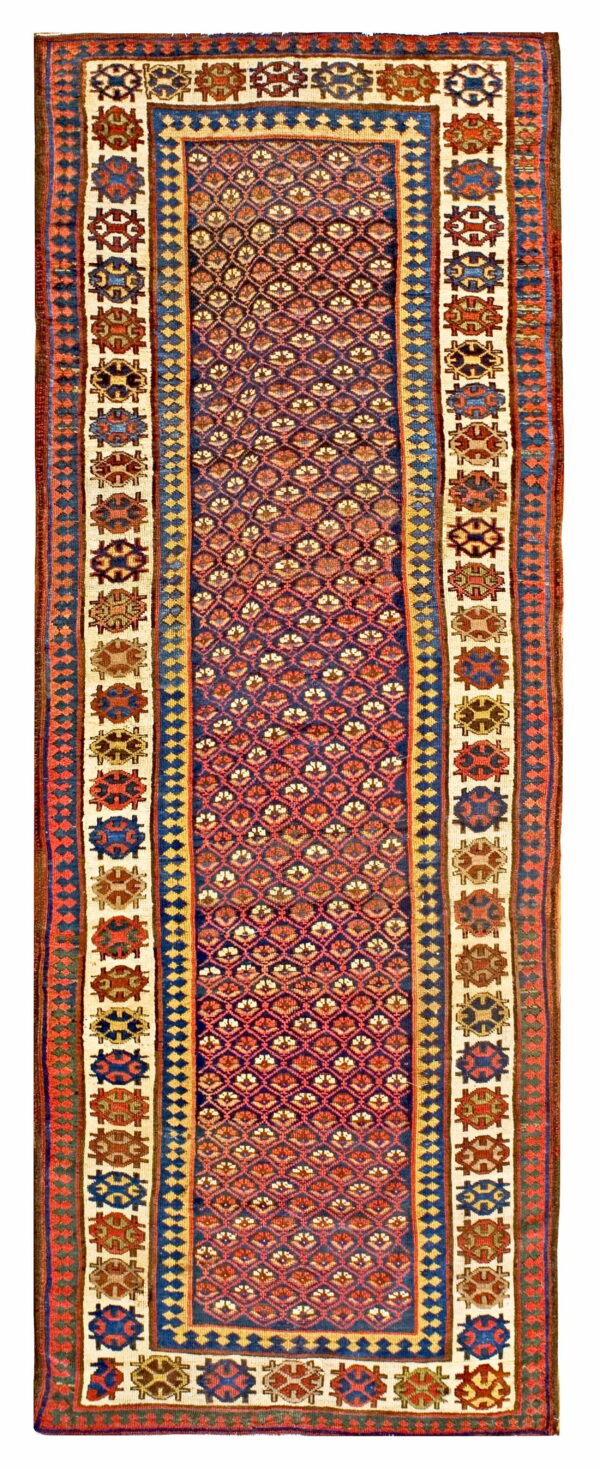 Red, blue, and cream runner rug with a repeating diamond pattern surrounded by octagonal medallions.