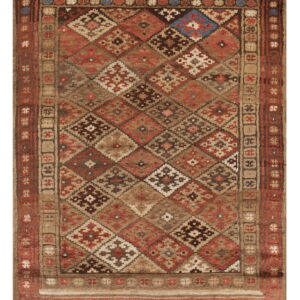 Geometric rug with diamonds and complex borders in brown, tan, deep red, and blue accents.