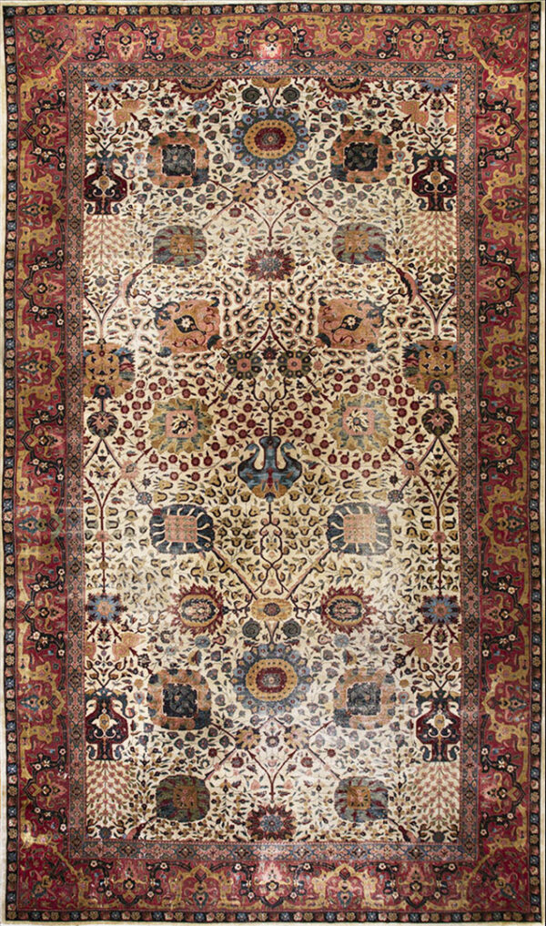 Rectangular rug with a cream field, dense floral and medallion pattern, bordered in deep red.