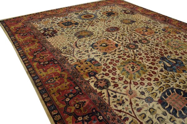 Detailed traditional rug featuring a colorful floral, vine, and stylized animal pattern on a light cream field.