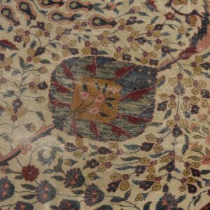 Intricate floral rug pattern on a beige ground featuring colors of deep red, navy, pink, and gold.