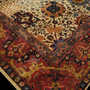 Close-up detail of a rug corner showing a beige floral field meeting a wide rust red patterned border.