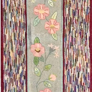 Narrow floral runner with a gray center bordered by textured, multicolored vertical segments.