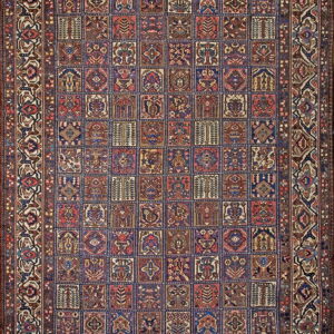 Dark blue, red, and brown traditional rug with an intricate checkerboard field and wide floral borders.