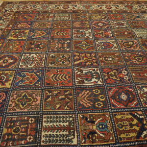 Red, blue, and yellow squares create a repeating garden panel pattern on wood flooring.