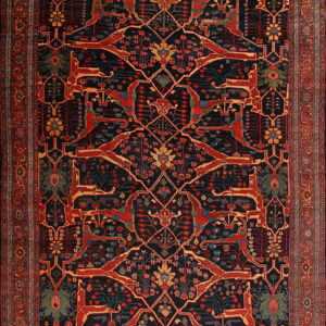 Rectangular rug featuring a dark blue field with a dense trellis pattern incorporating red stylized animal figures.