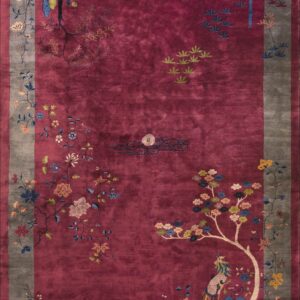 Saturated magenta rug featuring a gray border and complex floral and scenic avian patterns.
