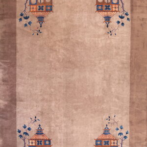 Tan rug with corner blue and orange pagoda motifs framed by a darker brown border.