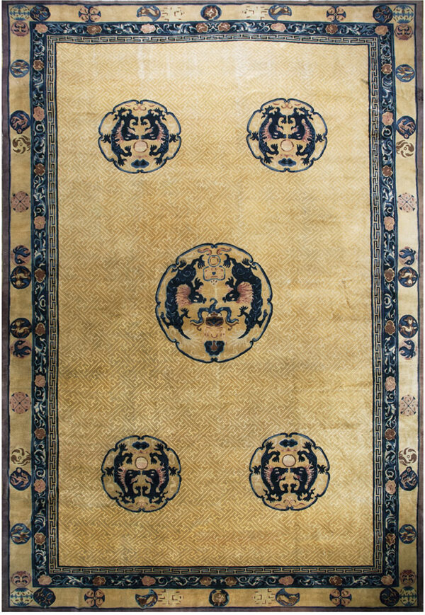 Golden yellow rug featuring a subtle fret background and five contrasting circular dark blue dragon motifs.