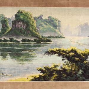 Panoramic green and blue landscape rug showing towering mountains, water, and bamboo, with a wide brown border.
