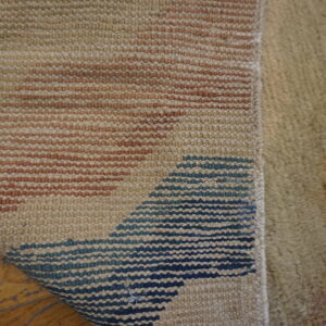 Textured rug with abstract patterns.