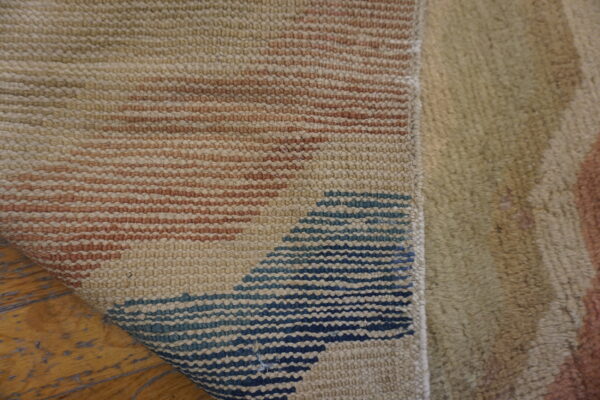 Textured rug with abstract patterns.