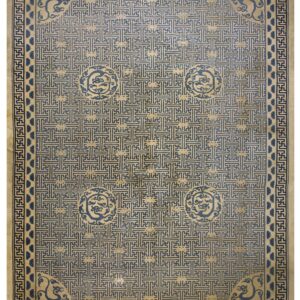 A rectangular blue and beige rug with a dense geometric fret pattern and circular dragon motifs.