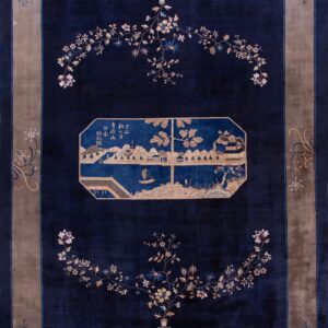 Elegant blue rug with floral patterns.