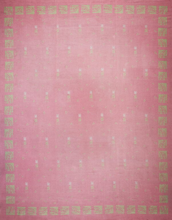 A pink low-pile rug featuring a repeating pattern of stylized light green tulips and a squared art nouveau border.