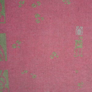 Flat woven textile detail in pink and green with stylized floral elements and geometric border squares.