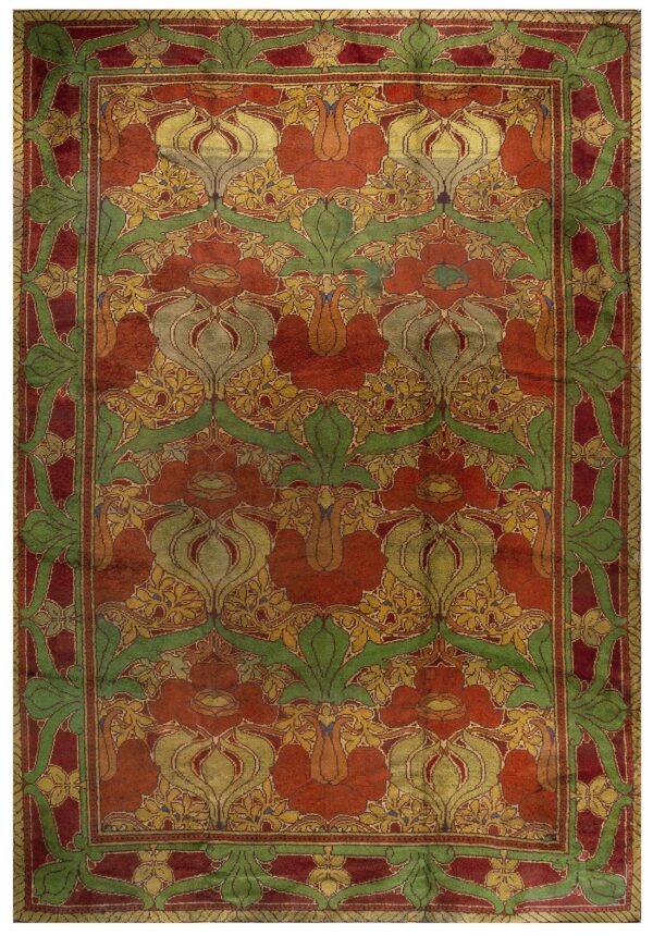 Reddish-orange rug featuring thick green borders and repeating stylized yellow and olive floral motifs.