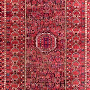 Vibrant red patterned antique knotted rug