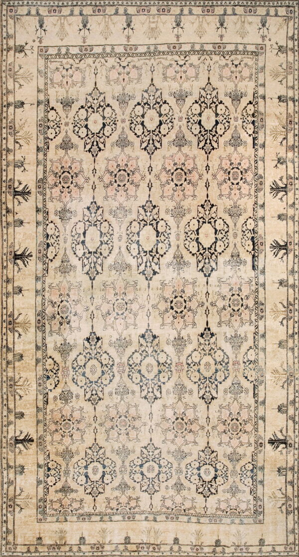 Beige rug with repeating dark medallions and pink floral details, framed by several ornate borders.