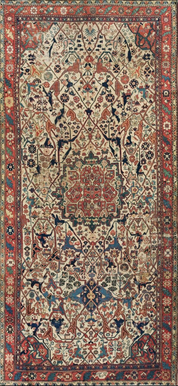 Ivory field rug featuring a complex geometric and stylized floral pattern in navy, rust, and teal with a red border.