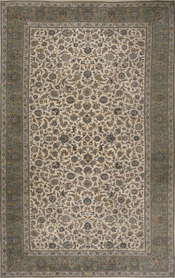 Cream rug featuring an all-over floral pattern and a wide sage green and ivory ornamental border.