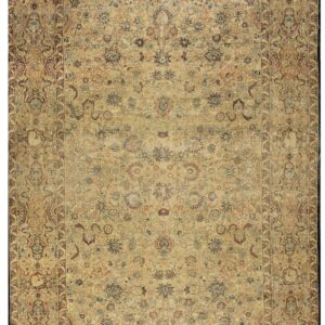 Detailed traditional rug featuring an all-over ornate floral pattern in muted beige, brown, and subtle colors.