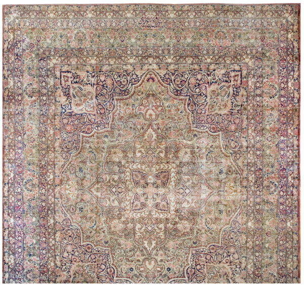 Faded traditional rug with a large central medallion and detailed borders in pale pink, blue, and beige.
