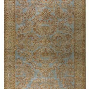 Distressed traditional rug featuring a light blue field and ornate copper-brown floral patterns.