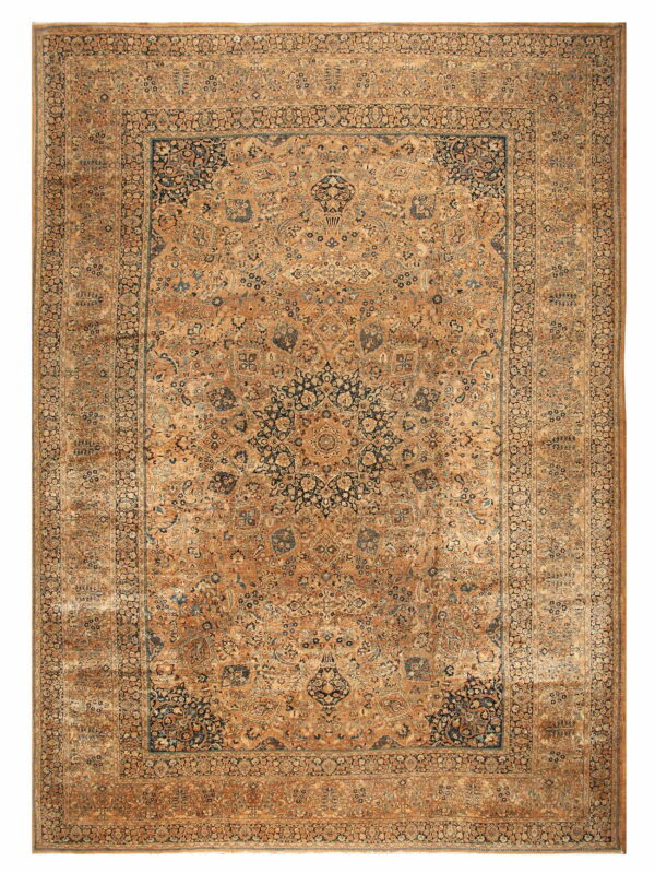 Ornate traditional rug with a large navy blue medallion set on a detailed gold-brown field.