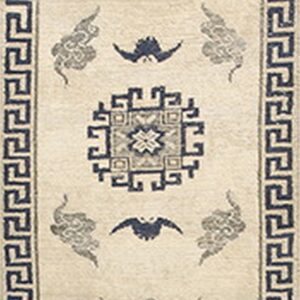 Cream runner rug with navy geometric borders surrounding central medallions, clouds, and small bat motifs.