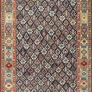 Long dark blue runner with an intricate repeating pattern and wide decorative borders in beige, red, and blue.