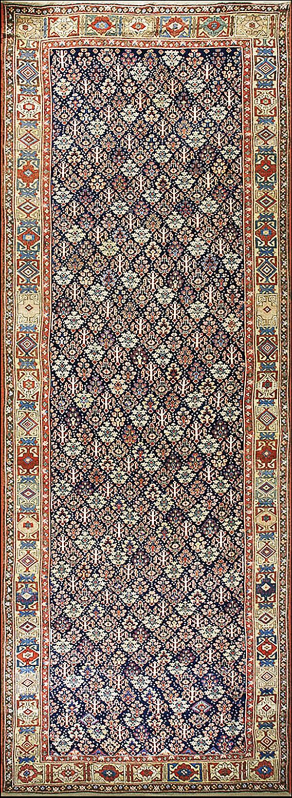 Long dark blue runner with an intricate repeating pattern and wide decorative borders in beige, red, and blue.