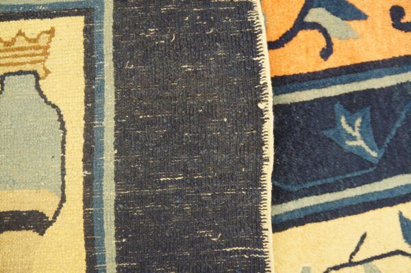 Detail shot comparing low-pile cream and blue geometric patterns with adjacent high-pile orange and navy blue rug patterns.