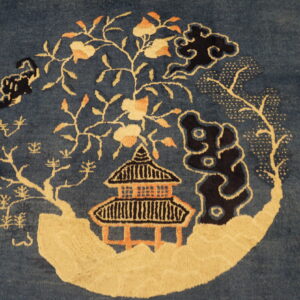 Blue rug with intricate floral design.