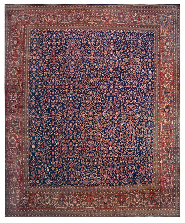 Intricate floral rug featuring a dark blue field framed by a wide, patterned rust red border.