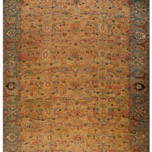 Low-pile rug with a complex all-over design of gold, terracotta, and dark teal floral motifs.