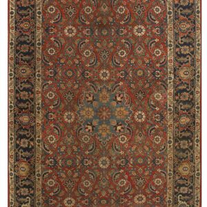 Rust-red runner rug with an all-over complex floral pattern and dark navy blue outer and inner borders.